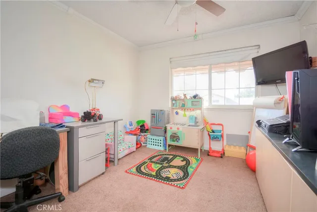 a playing room with furniture and a window