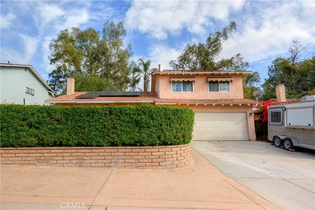 a view of a house with a garden