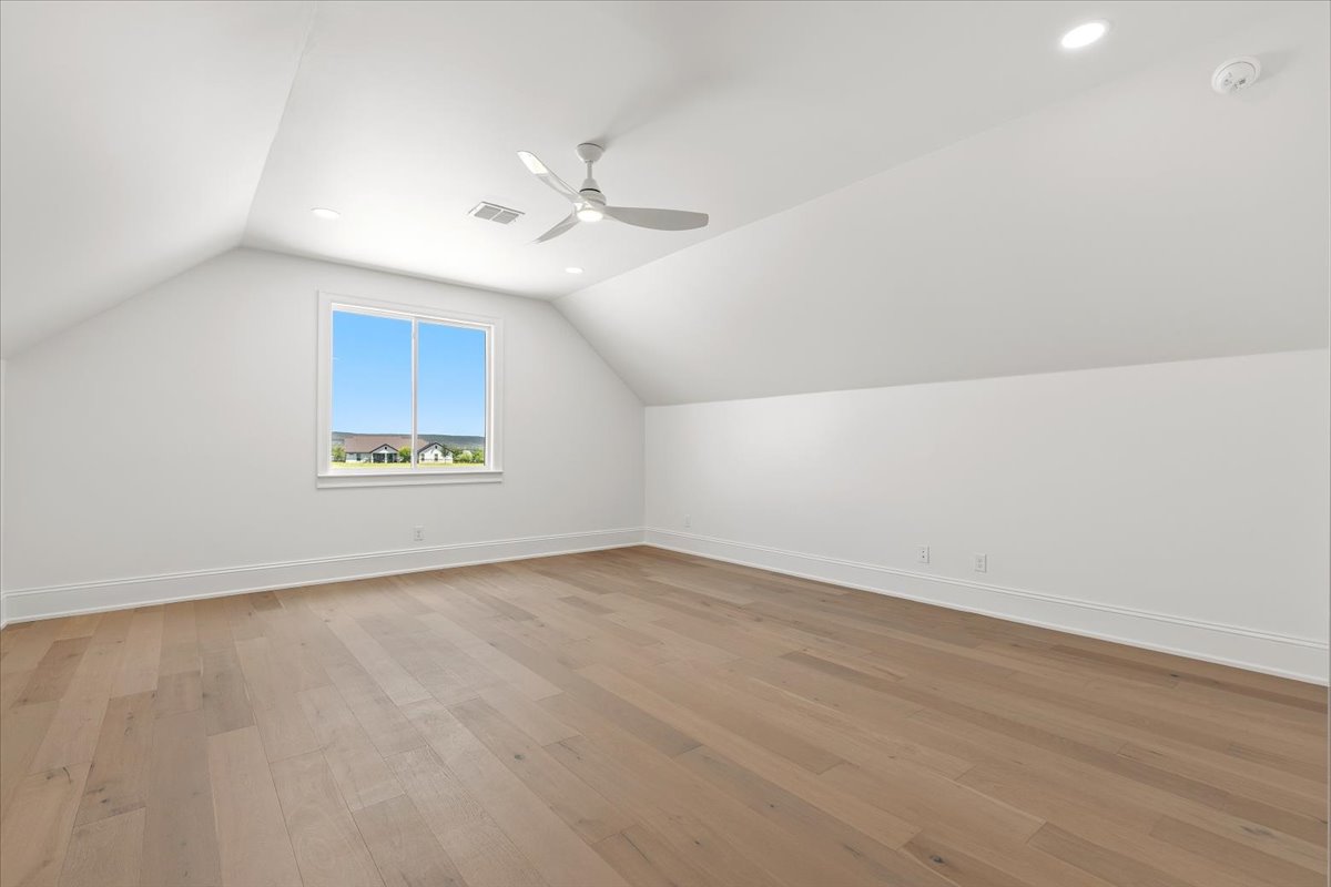 224 Sandia Loop Kingsland, TX 78639 - Photo 24 of 32 an empty room with a window and ceiling fan