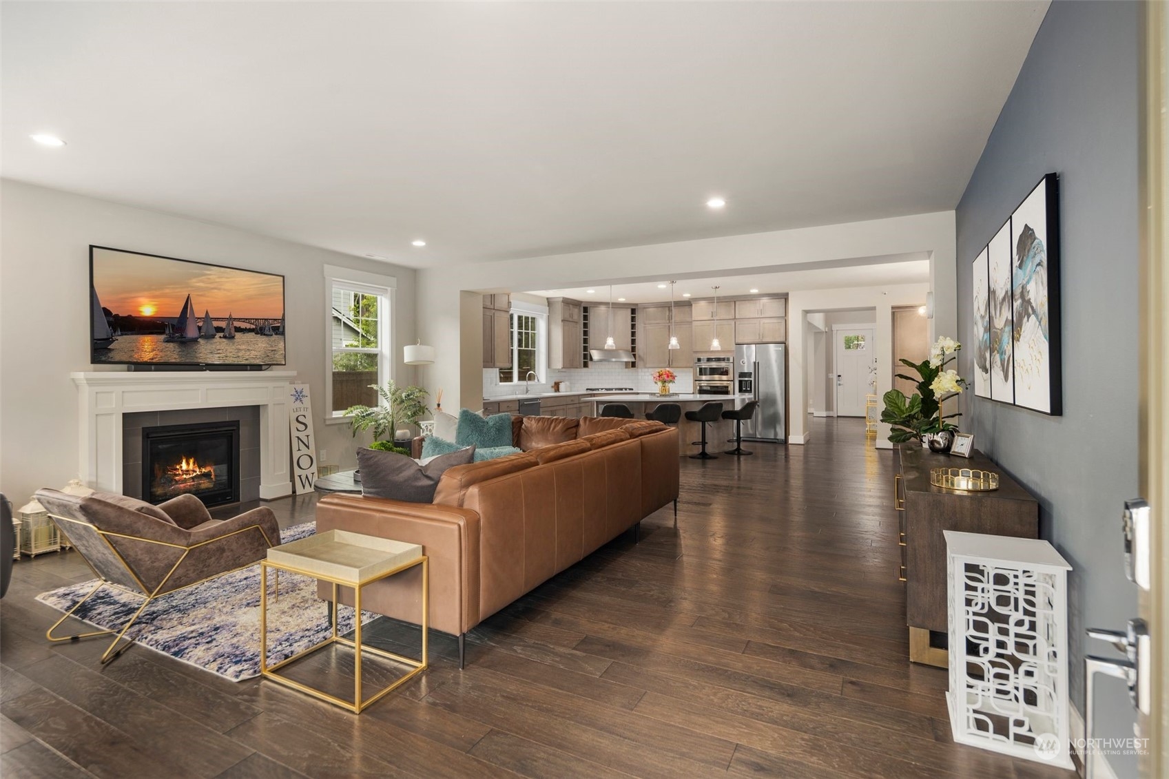 16025 Southeast 144th Street Renton, WA 98059 - Photo 13 of 40 a living room with fireplace furniture and a flat screen tv
