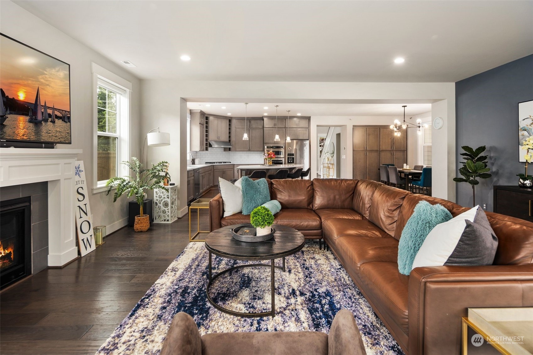 16025 Southeast 144th Street Renton, WA 98059 - Photo 15 of 40 a living room with furniture a fireplace and a flat screen tv