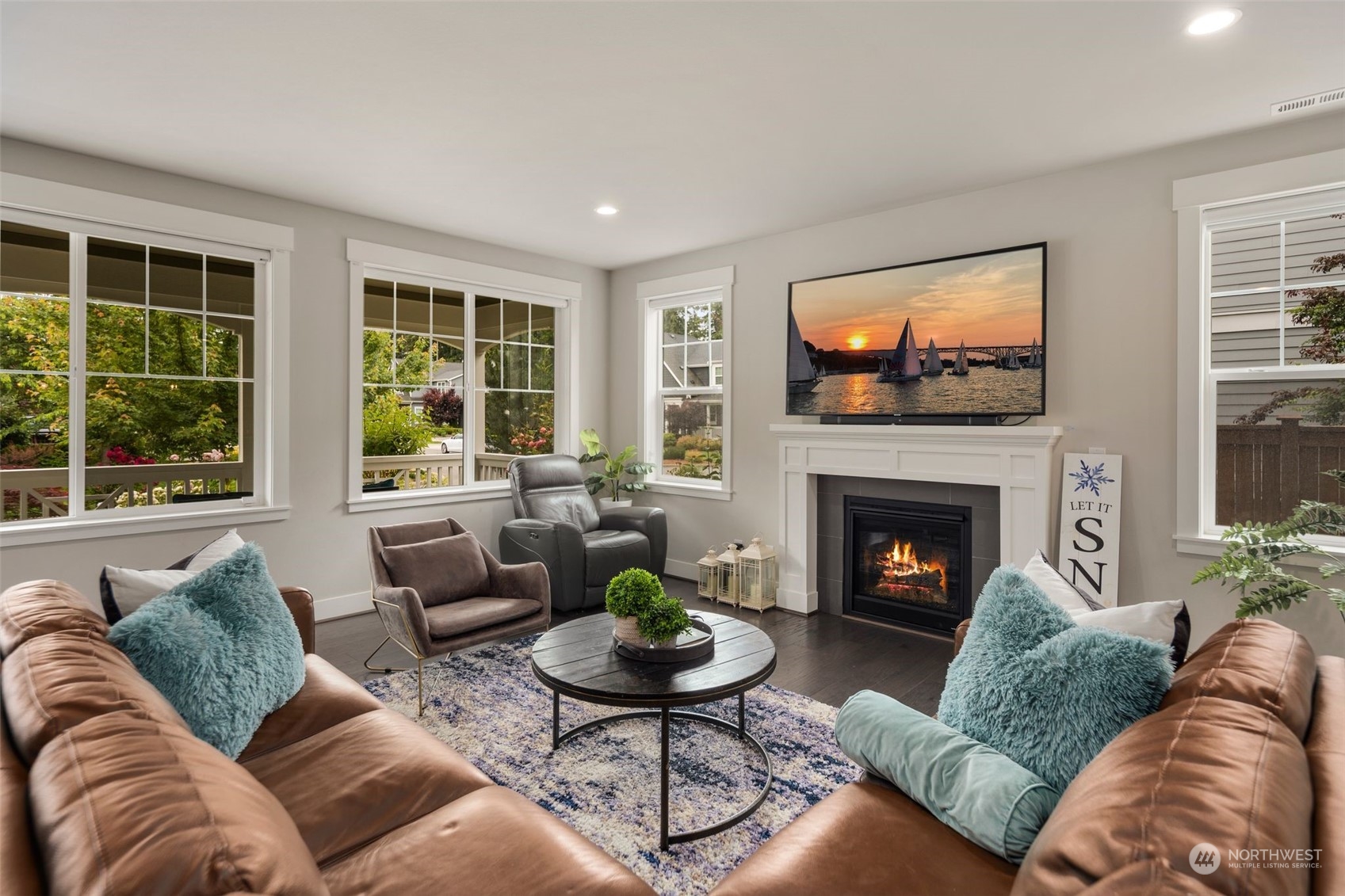 16025 Southeast 144th Street Renton, WA 98059 - Photo 17 of 40 a living room with furniture flat screen tv and a fireplace