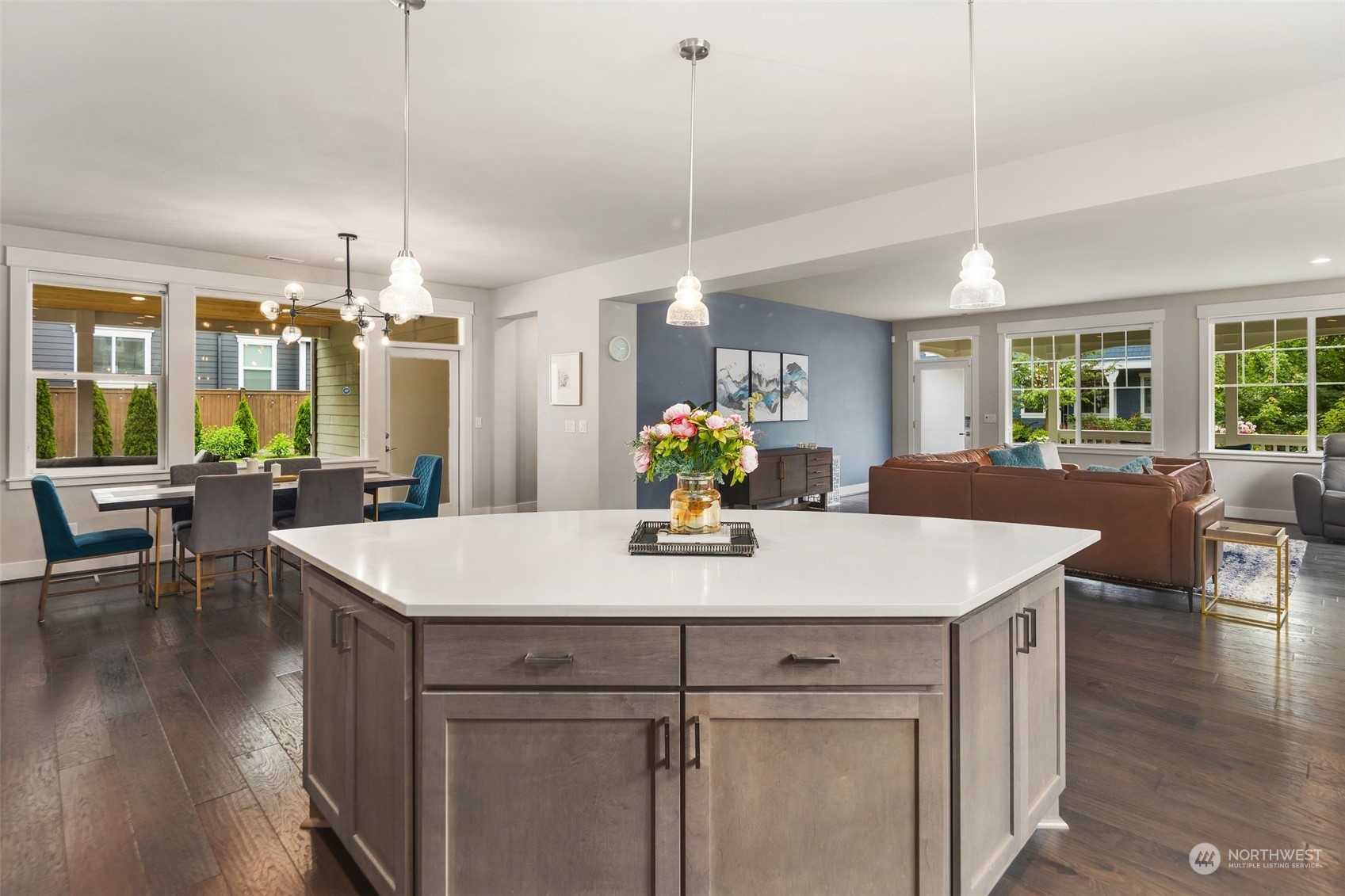 16025 Southeast 144th Street Renton, WA 98059 - Photo 23 of 40 a view of a kitchen counter space dining table chairs and wooden floor