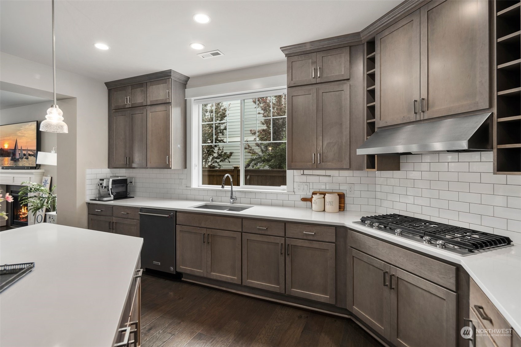 16025 Southeast 144th Street Renton, WA 98059 - Photo 24 of 40 a kitchen with a sink stove and cabinets