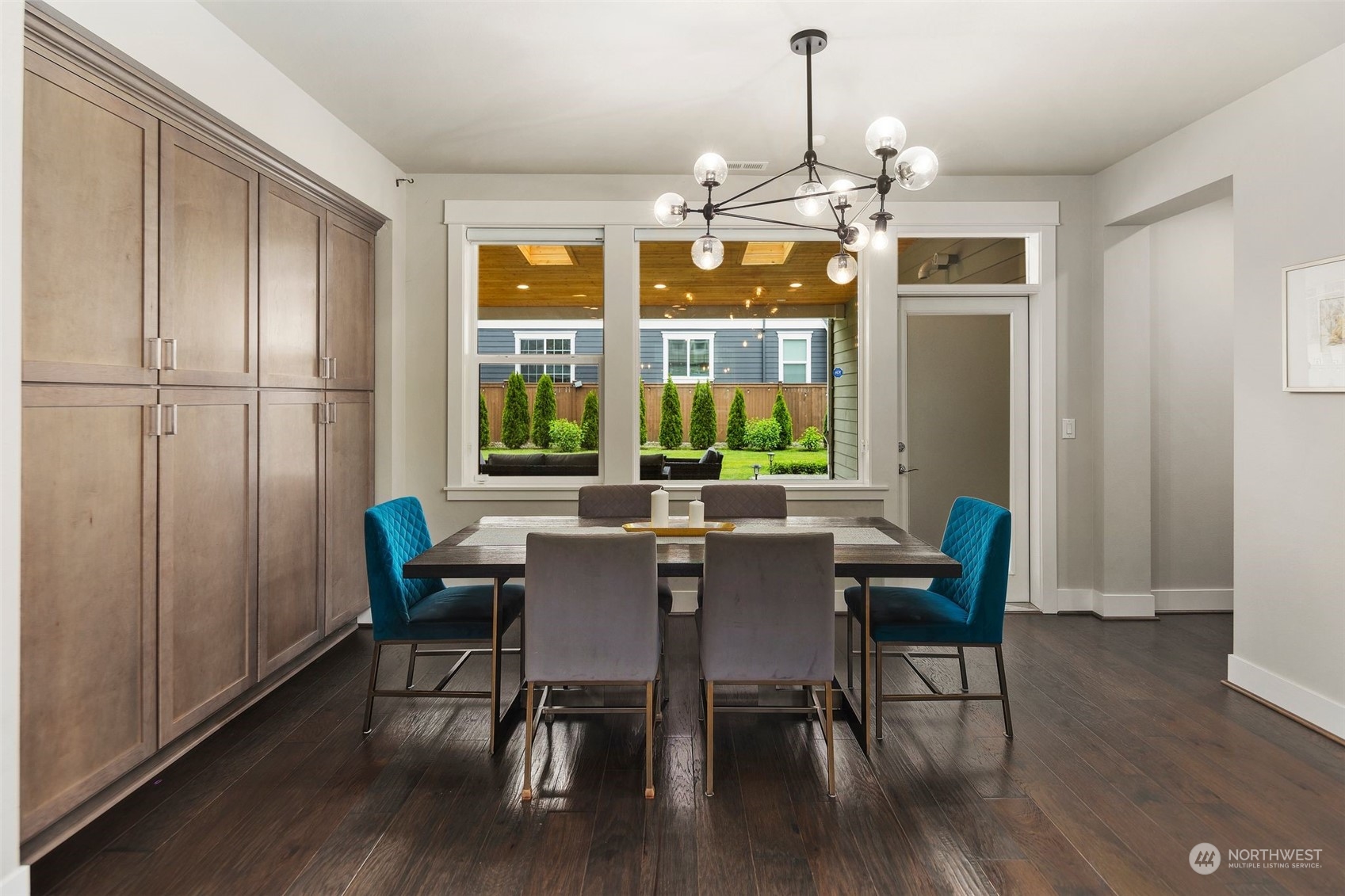 16025 Southeast 144th Street Renton, WA 98059 - Photo 26 of 40 a view of a dining room with furniture window and wooden floor