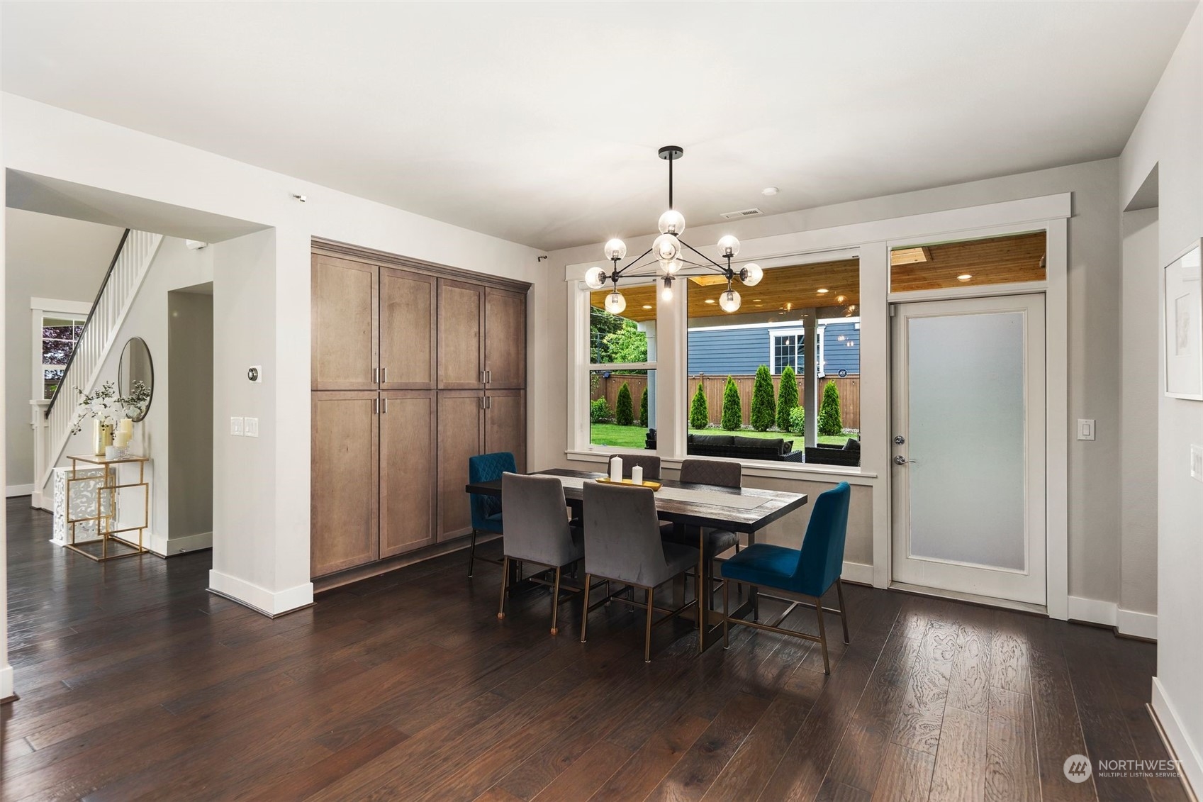 16025 Southeast 144th Street Renton, WA 98059 - Photo 27 of 40 a view of a dining room with furniture window and wooden floor