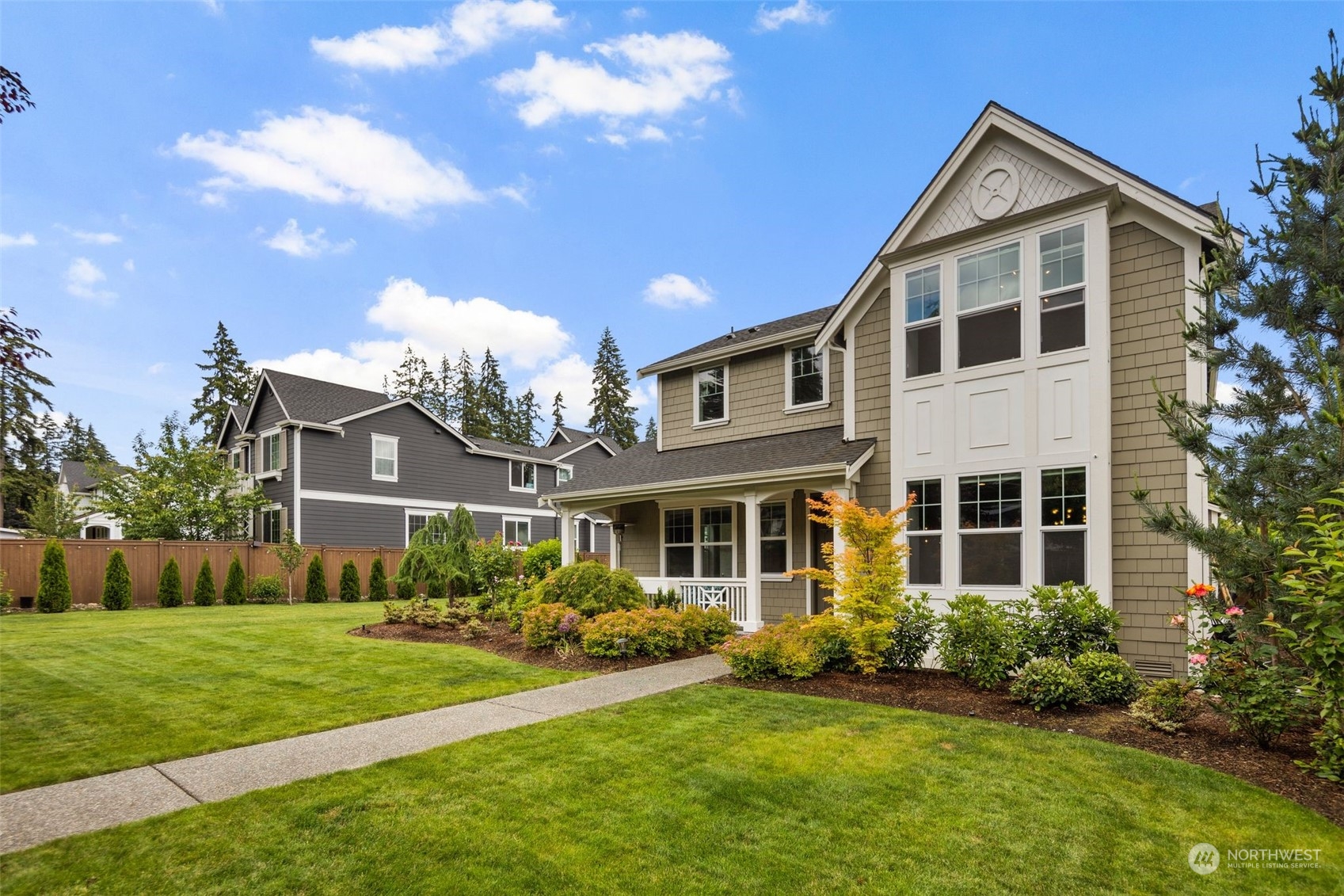 16025 Southeast 144th Street Renton, WA 98059 - Photo 3 of 40 a front view of a house with a yard