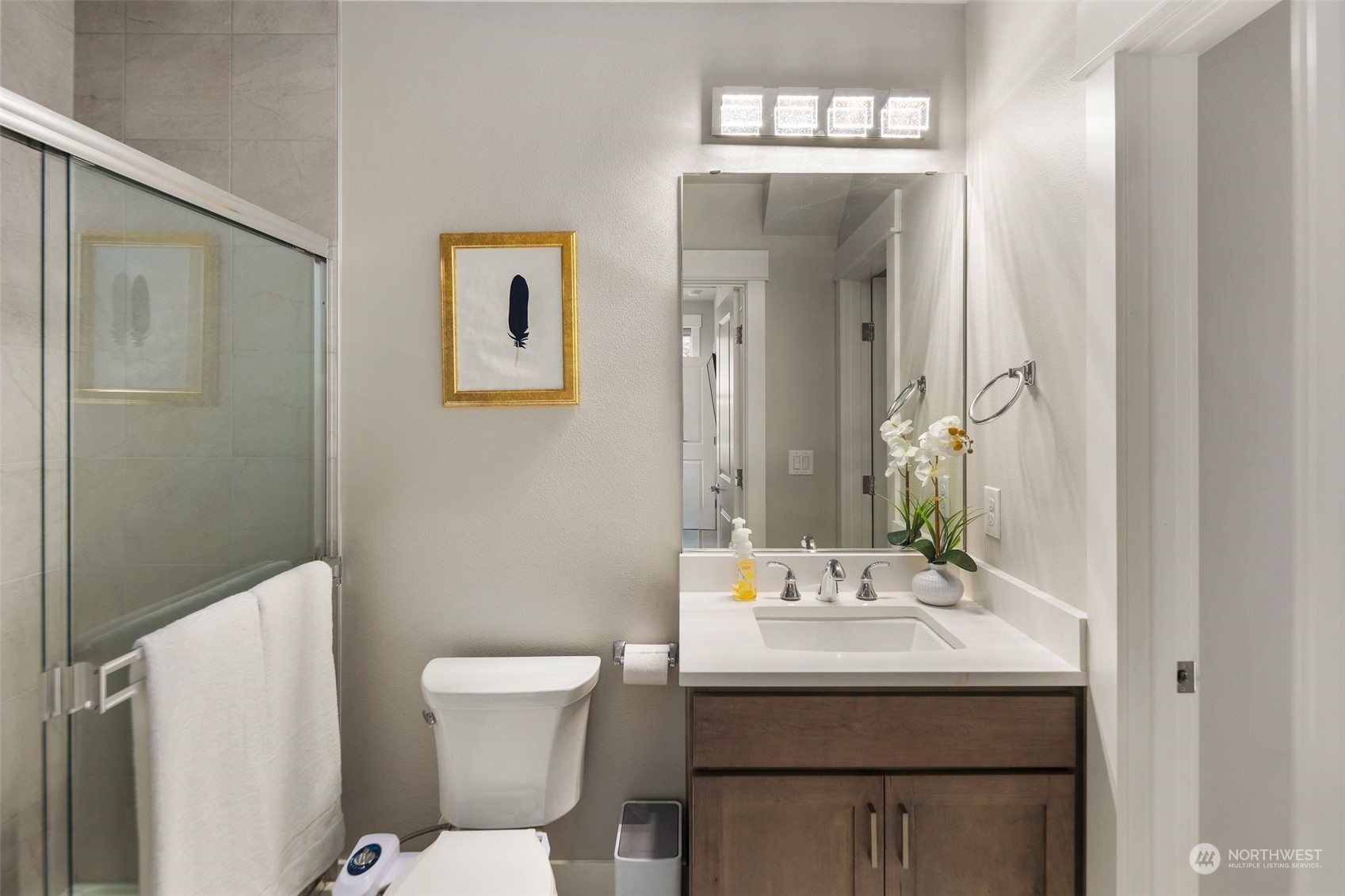 16025 Southeast 144th Street Renton, WA 98059 - Photo 31 of 40 a bathroom with a sink a toilet and mirror