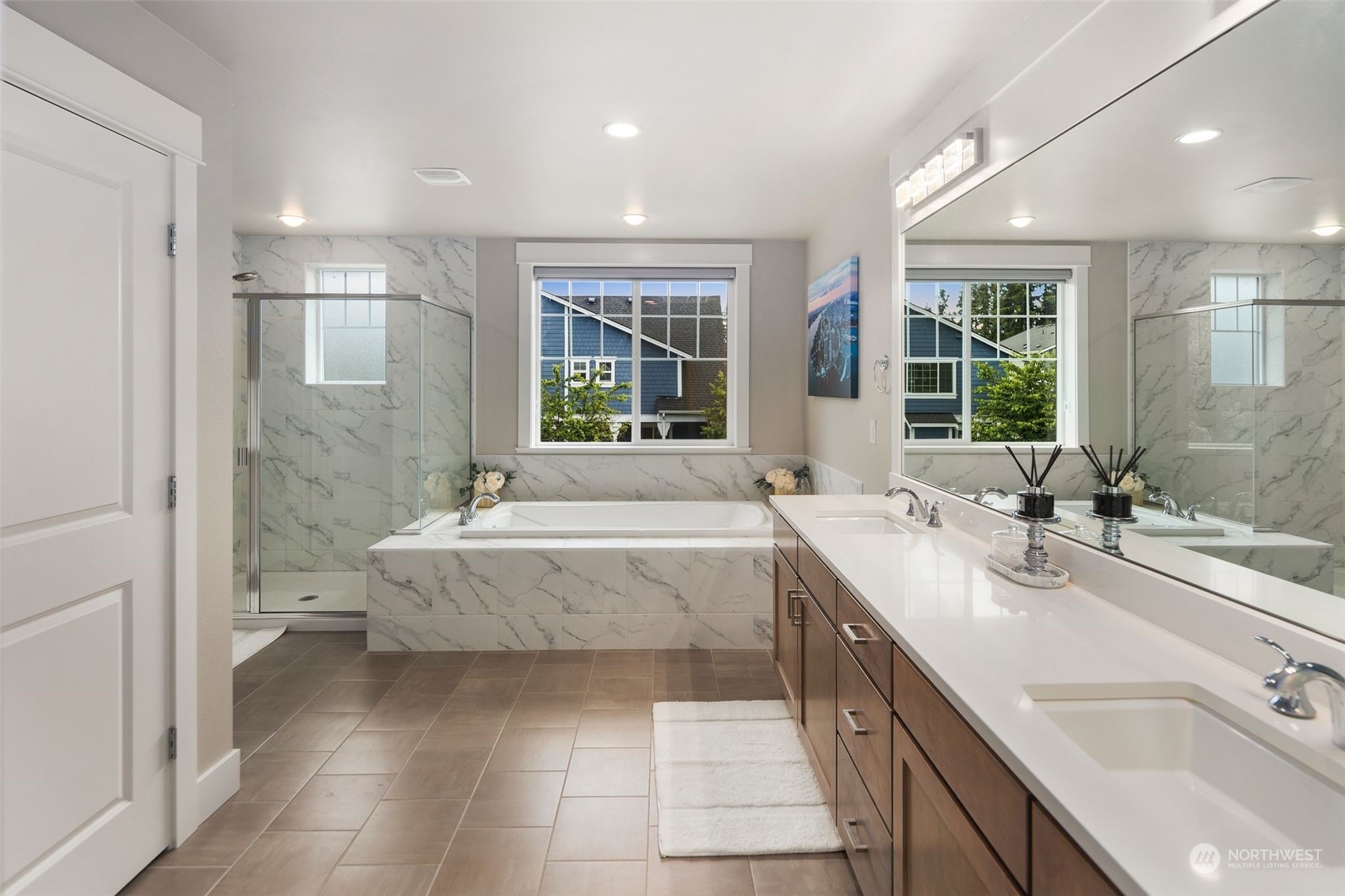 16025 Southeast 144th Street Renton, WA 98059 - Photo 35 of 40 a spacious bathroom with a tub double sink and mirror