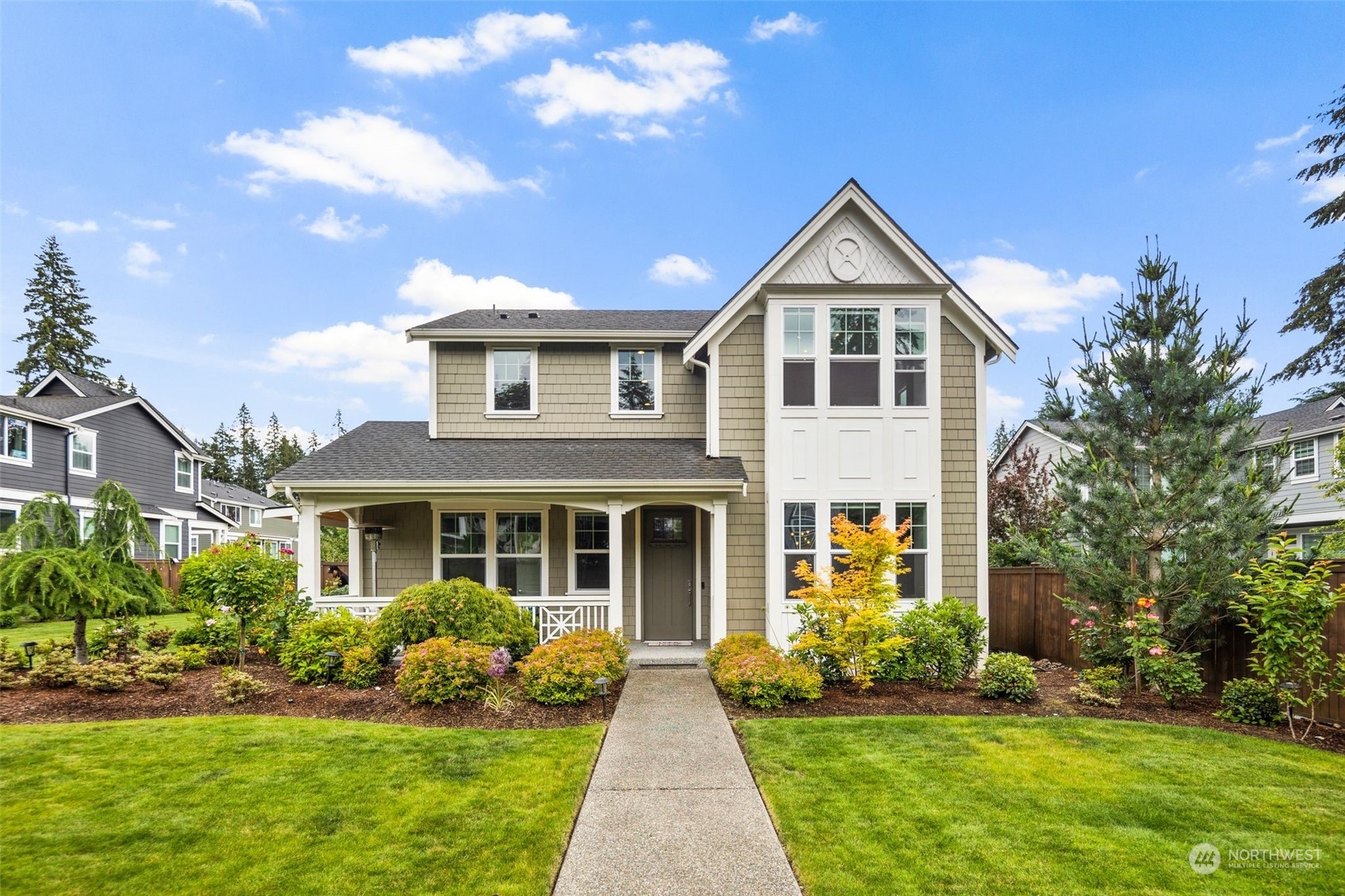 16025 Southeast 144th Street Renton, WA 98059 - Photo 4 of 40 a front view of a house with a yard