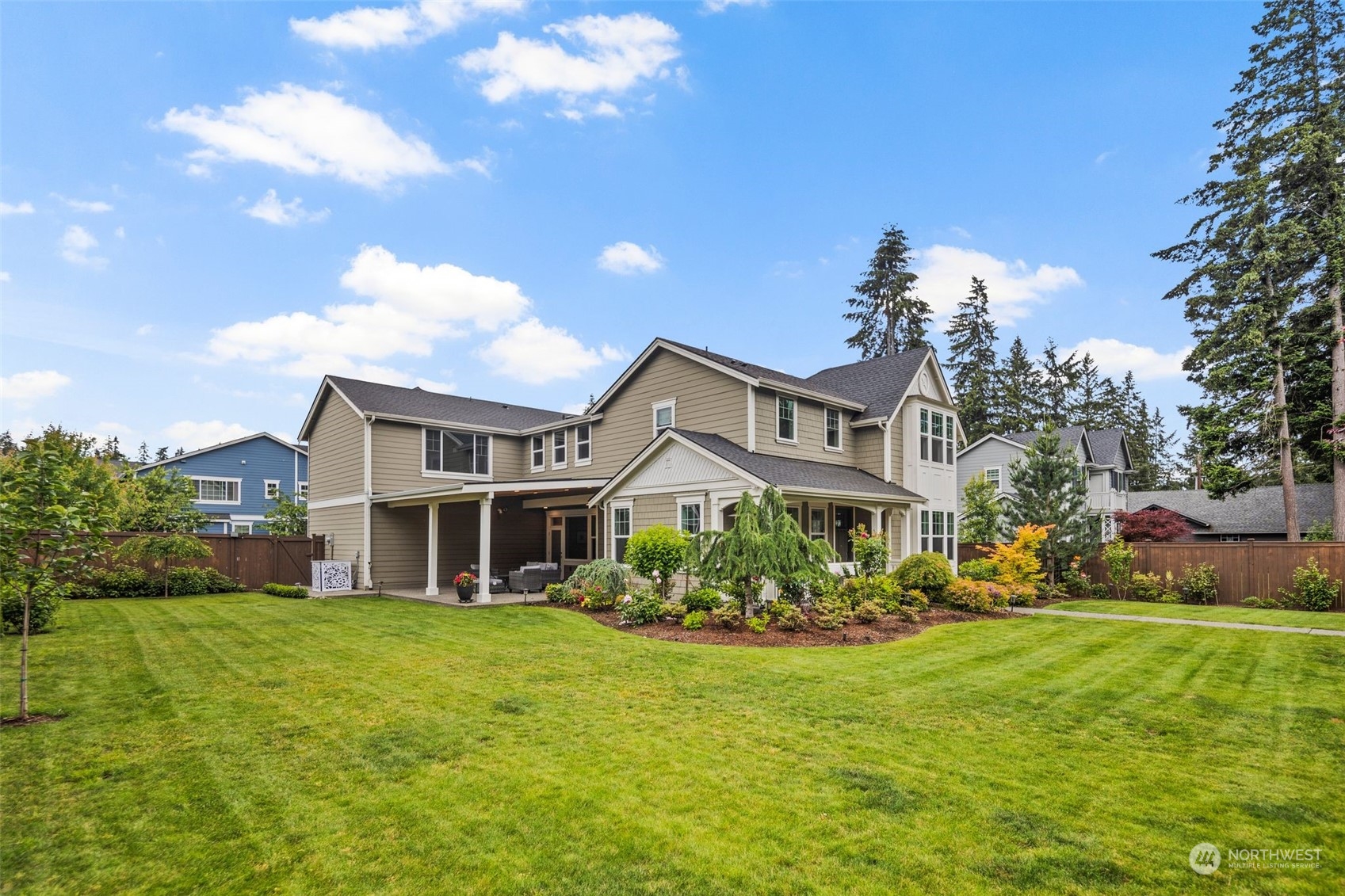 16025 Southeast 144th Street Renton, WA 98059 - Photo 5 of 40 a front view of a house with garden