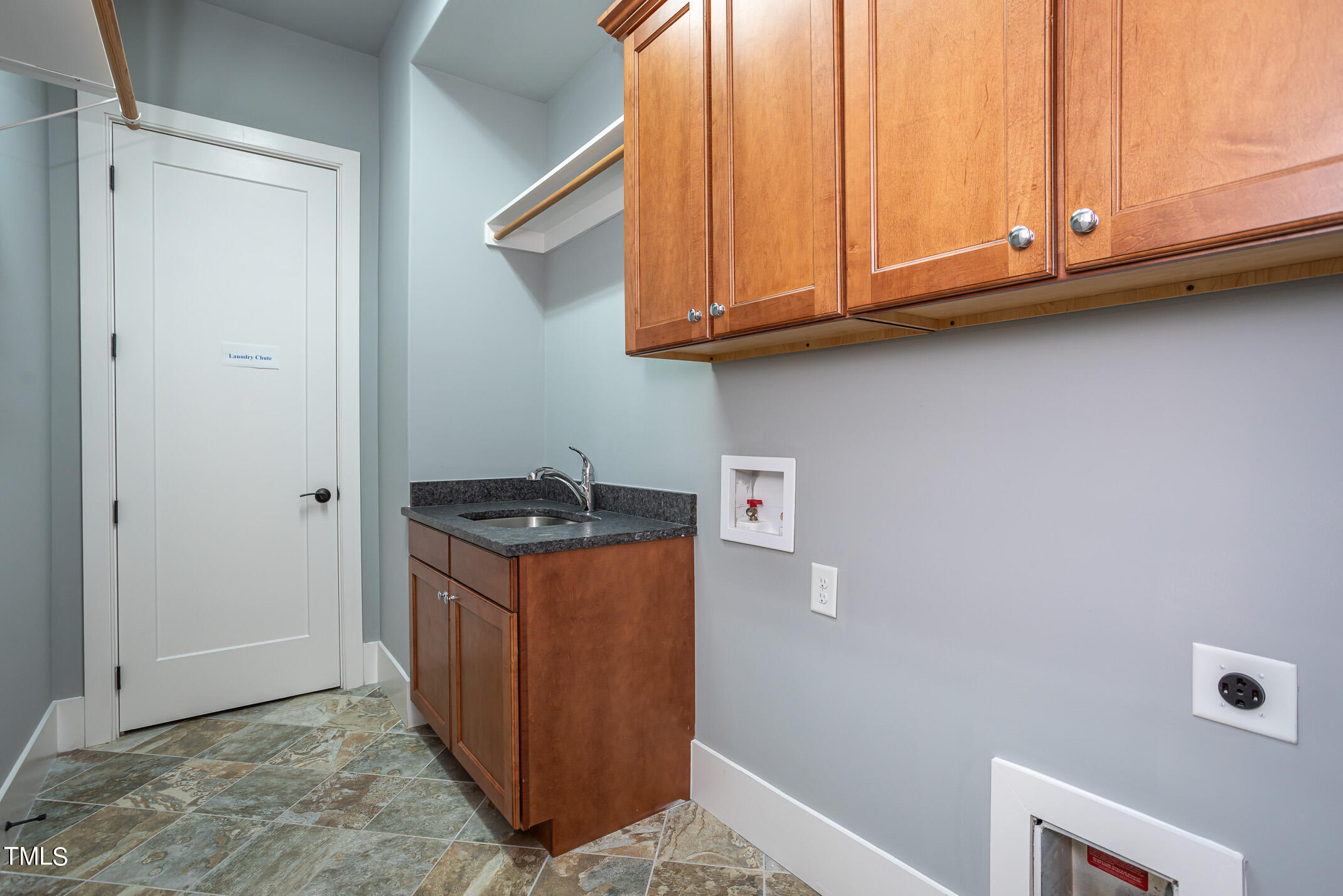 4126 Rockingham Street Raleigh, NC 27609 - Photo 23 of 60 Main floor laundry with laundry chute