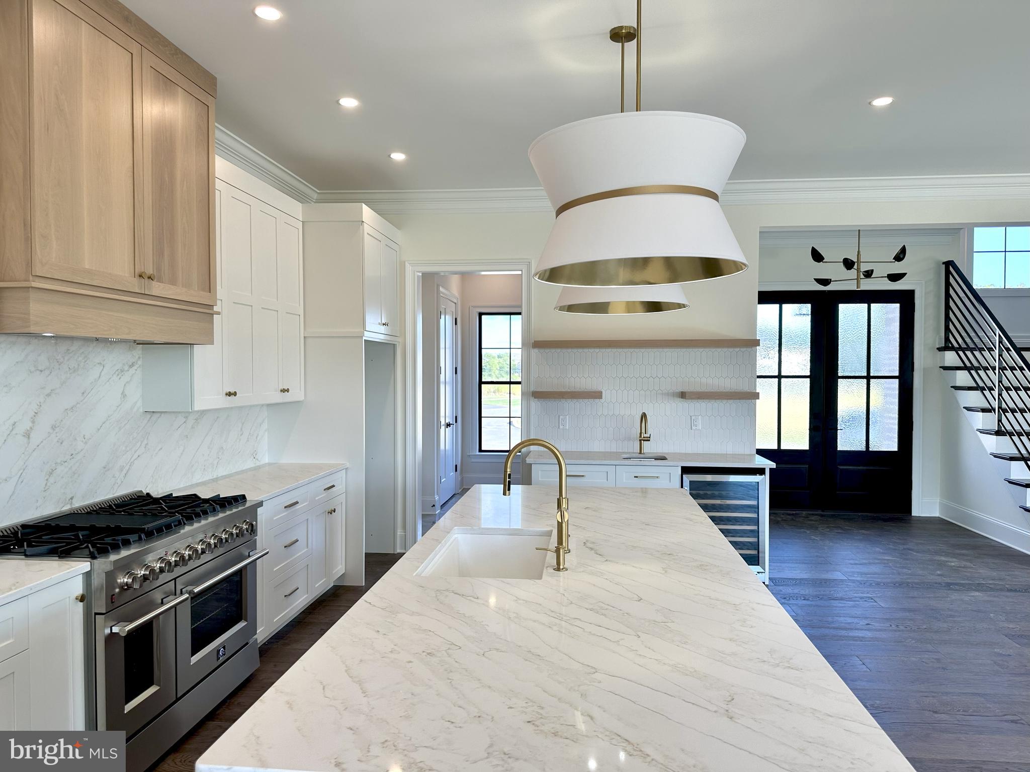 539 Sierra Lane Lancaster, PA 17601 - Photo 12 of 33 a kitchen with stainless steel appliances granite countertop a stove and a wooden floors