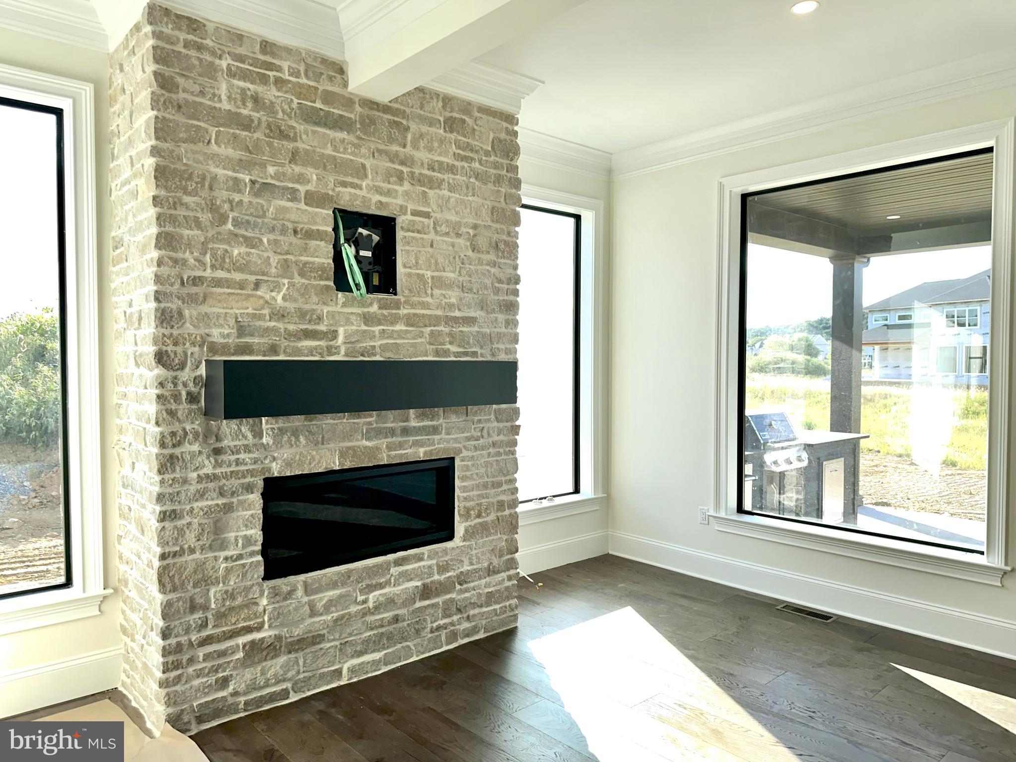 539 Sierra Lane Lancaster, PA 17601 - Photo 14 of 33 a living room with fireplace and a wooden floor