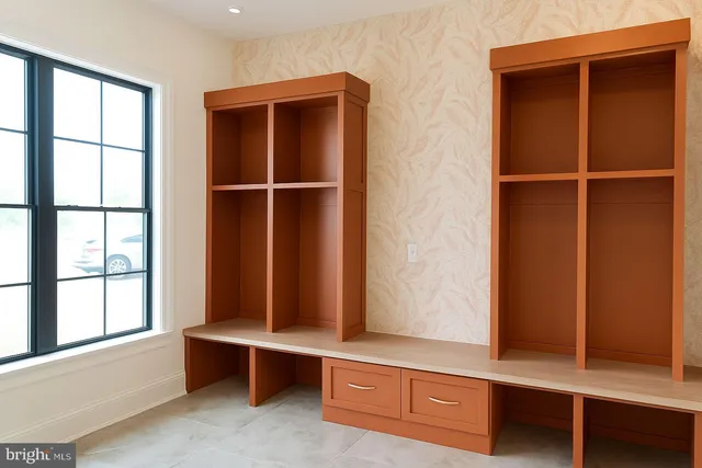 a view of room with window and cabinet