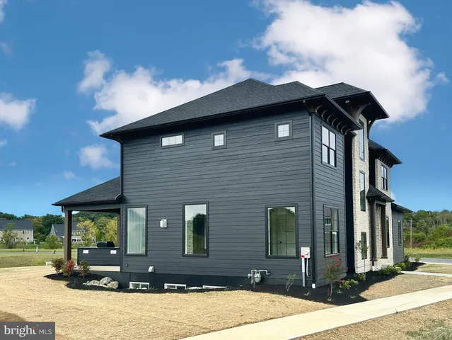 a front view of a house with yard