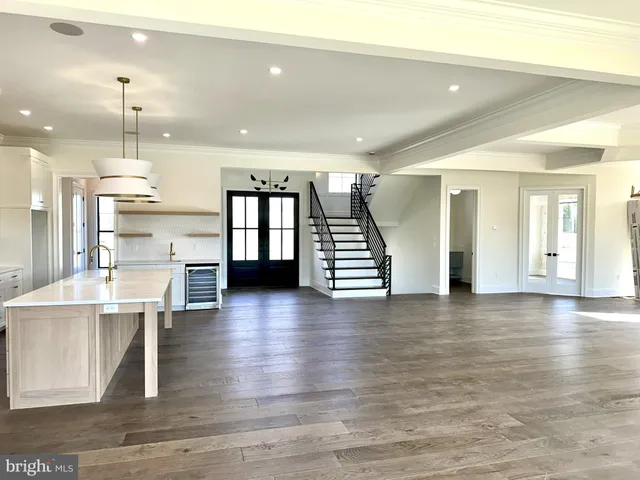 a view of kitchen with cabinets and wooden floor