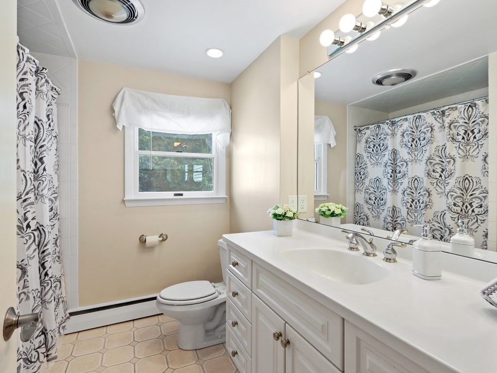 20 Woodbine Circle Needham, MA 02494 - Photo 12 of 34 a bathroom with a sink toilet and shower