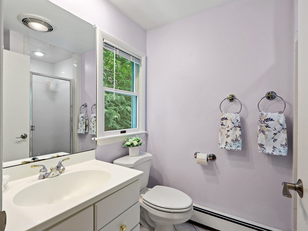 20 Woodbine Circle Needham, MA 02494 - Photo 18 of 34 a bathroom with a sink toilet and window