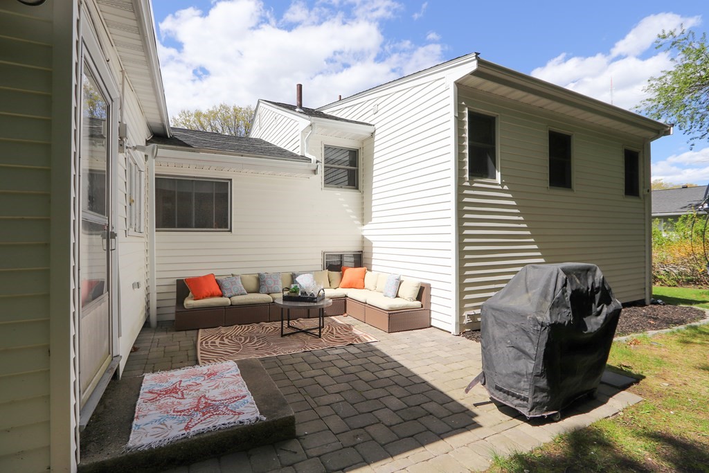 20 Woodbine Circle Needham, MA 02494 - Photo 29 of 34 a view of a patio with couches and a table and chairs