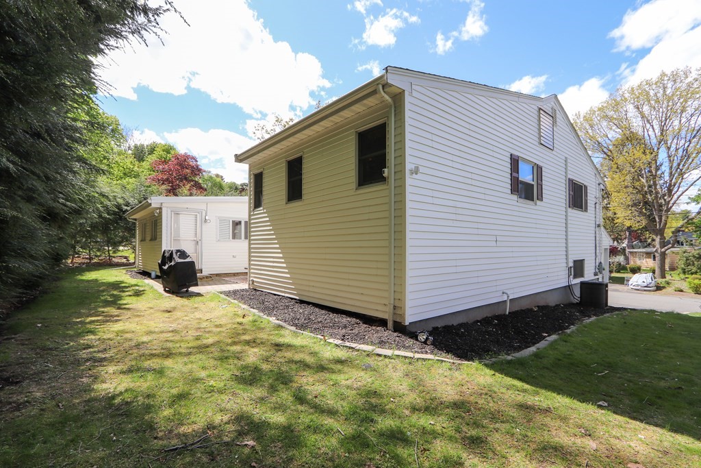 20 Woodbine Circle Needham, MA 02494 - Photo 30 of 34 a view of a house with backyard and sitting area