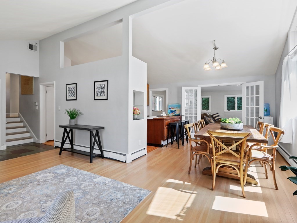 20 Woodbine Circle Needham, MA 02494 - Photo 4 of 34 a living room with furniture a dining table and a potted plant