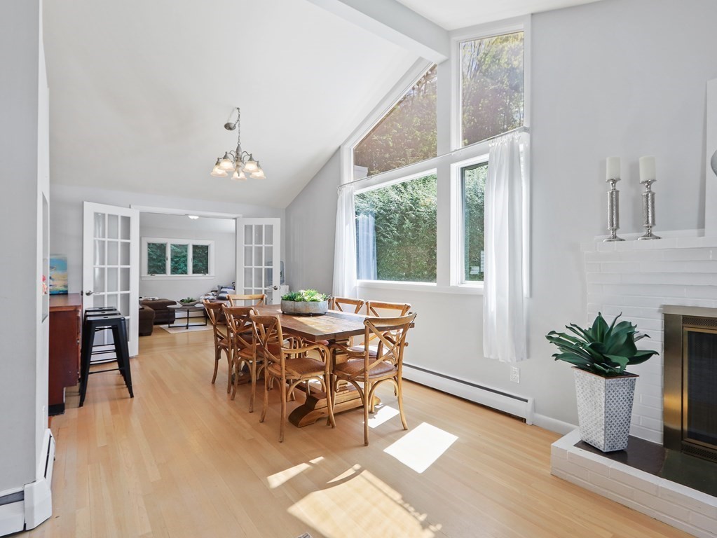 20 Woodbine Circle Needham, MA 02494 - Photo 5 of 34 a dining room with furniture potted plants and wooden floor