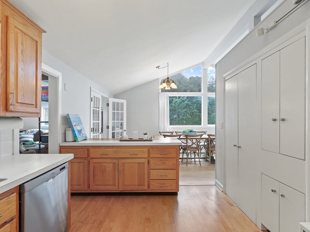 20 Woodbine Circle Needham, MA 02494 - Photo 10 of 34 a large kitchen with a lot of counter space and wooden floor