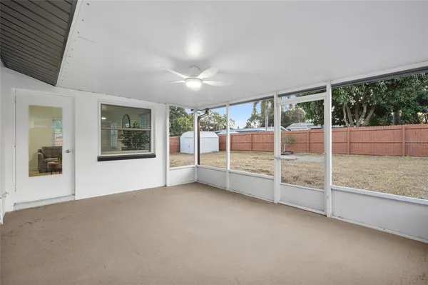 a view of an empty room with windows