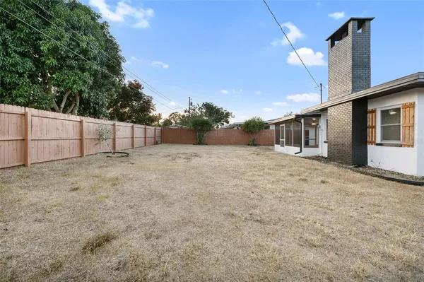 a view of backyard and tree