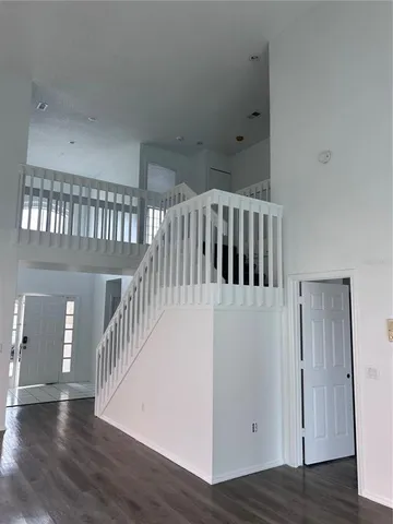 wooden floor in a hall with a window
