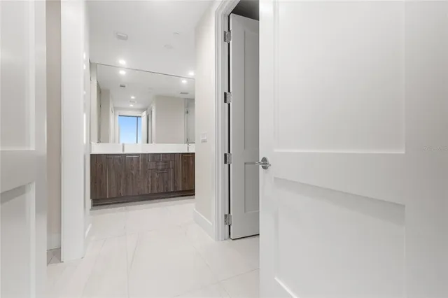 a bedroom with a large bed and a flat screen tv