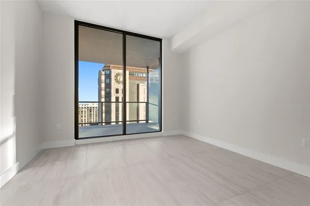 a bathroom with a shower sink and mirror