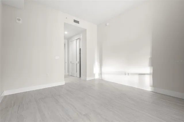 a kitchen with stainless steel appliances granite countertop a sink and a refrigerator