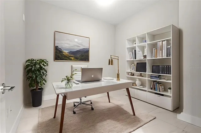 a dining room with furniture a livingroom and chandelier