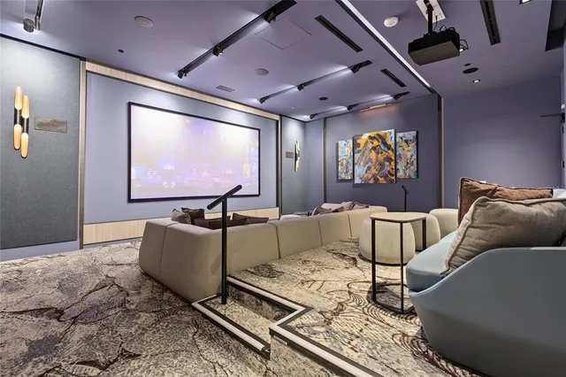 a view of a swimming pool with a table and chairs