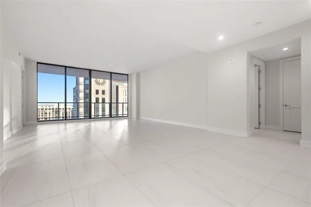 a bathroom with a shower sink and mirror