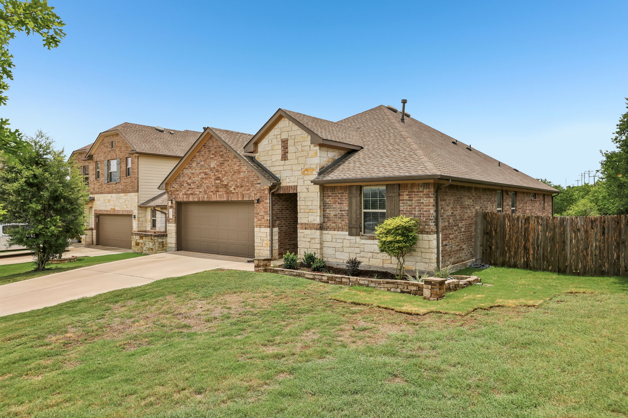 6801 Banff Cove Austin, TX 78754 - Photo 4 of 37 A charming blend of brick and stone accents creates an inviting facade for this home