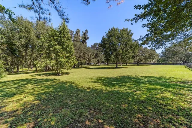 a view of a livingroom with furniture and a flat screen tv