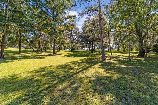 a large white kitchen with cabinets and furniture