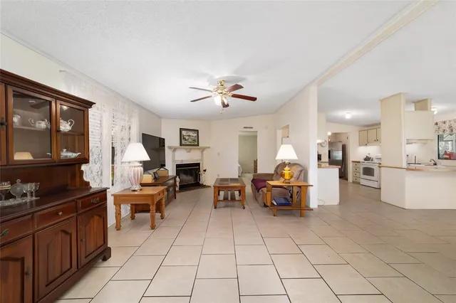 a bed room with a bed and a view of kitchen
