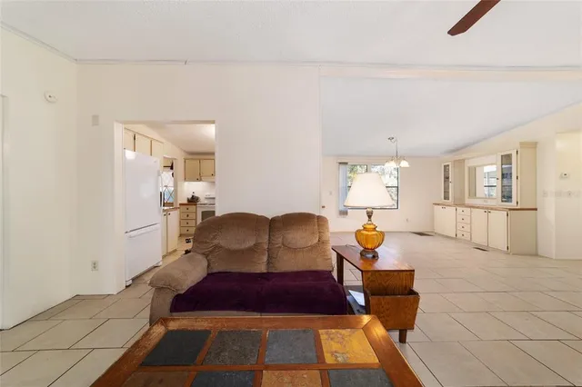 a spacious bedroom with a bed and a window