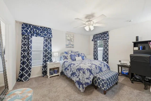 a bedroom with a bed and a chair