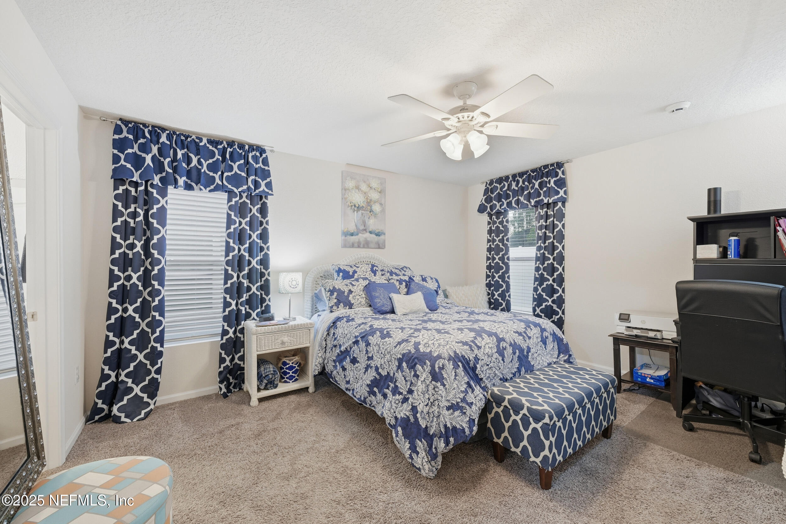 4068 Great Falls Loop Middleburg, FL 32068 - Photo 18 of 36 a bedroom with a bed and a chair