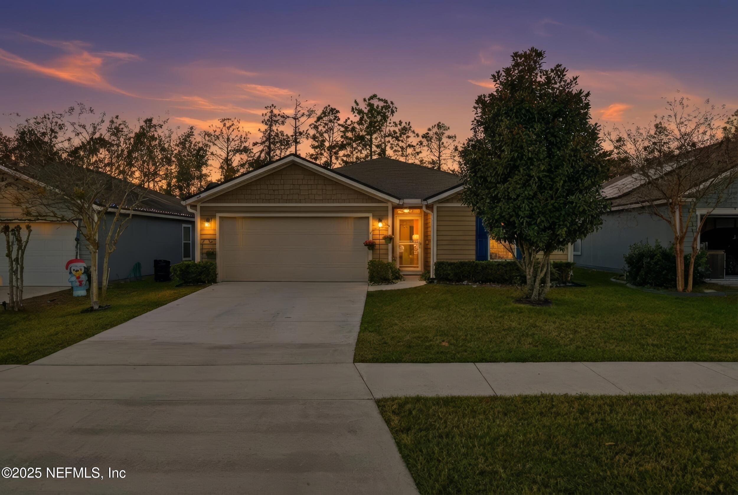 4068 Great Falls Loop Middleburg, FL 32068 - Photo 2 of 36 a front view of a house with a garden