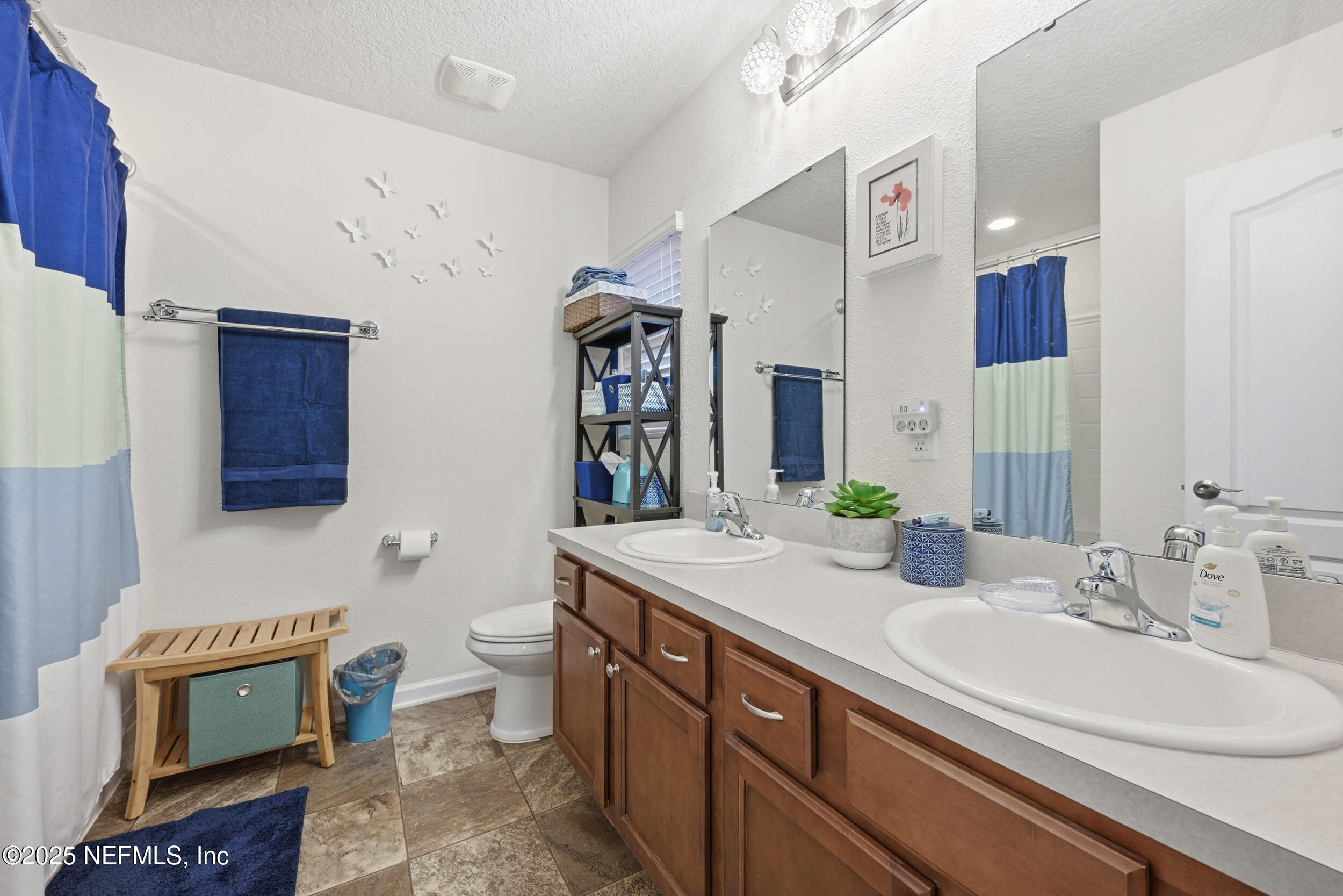 4068 Great Falls Loop Middleburg, FL 32068 - Photo 21 of 36 a bathroom with a sink double vanity and a toilet
