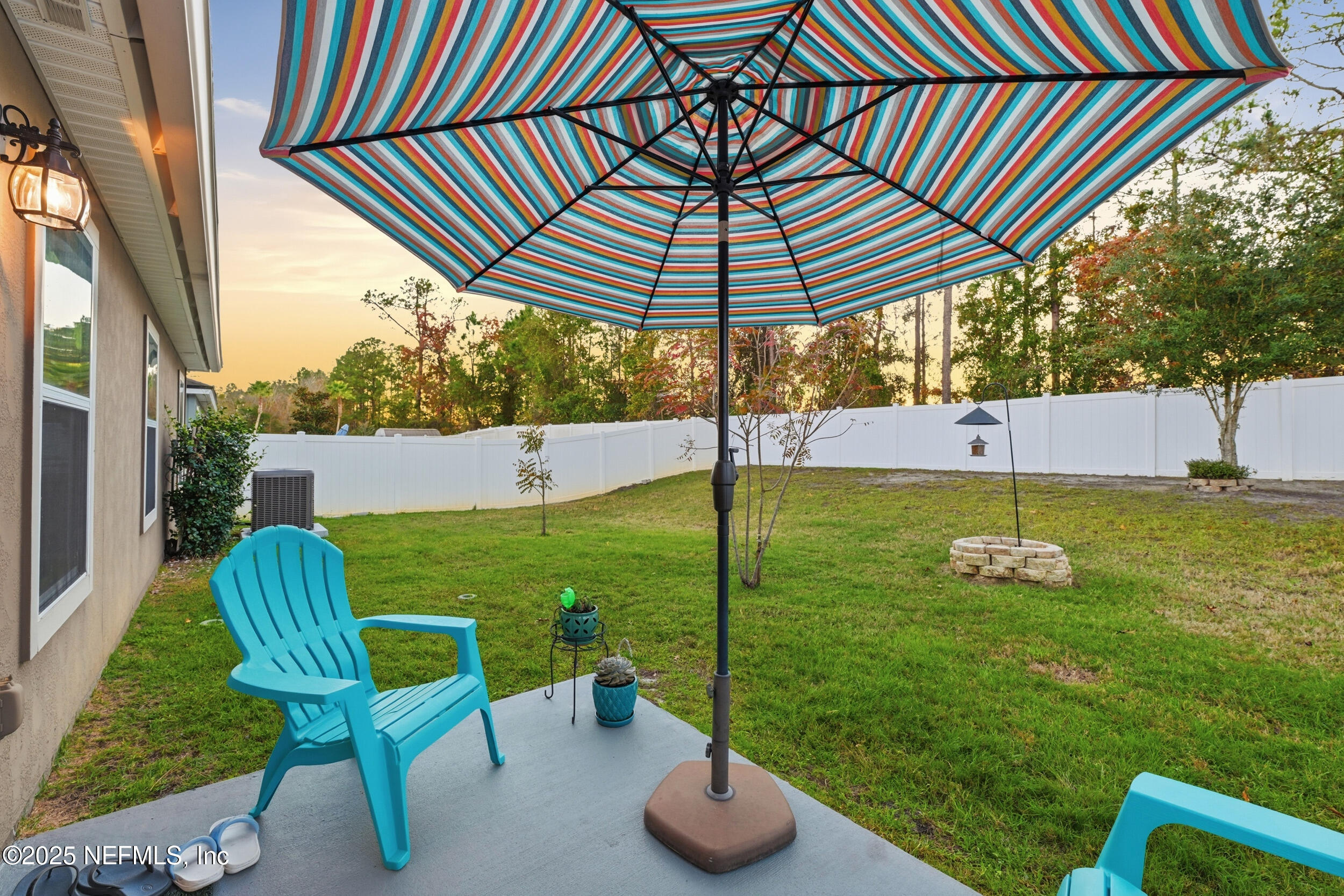4068 Great Falls Loop Middleburg, FL 32068 - Photo 24 of 36 a backyard of a house with table and chairs