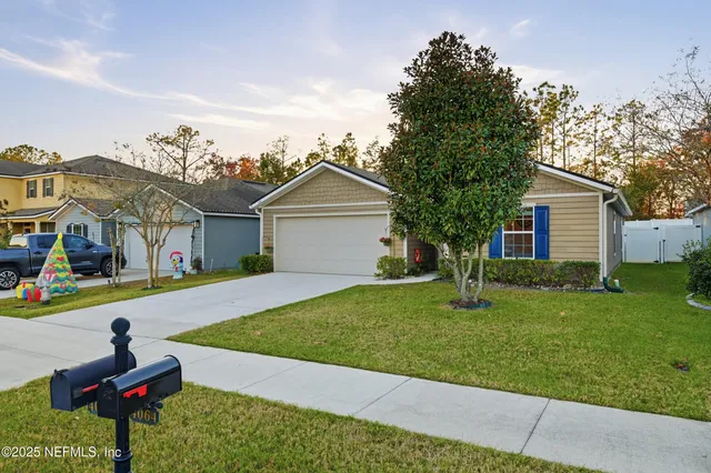 a front view of house with yard and outdoor seating