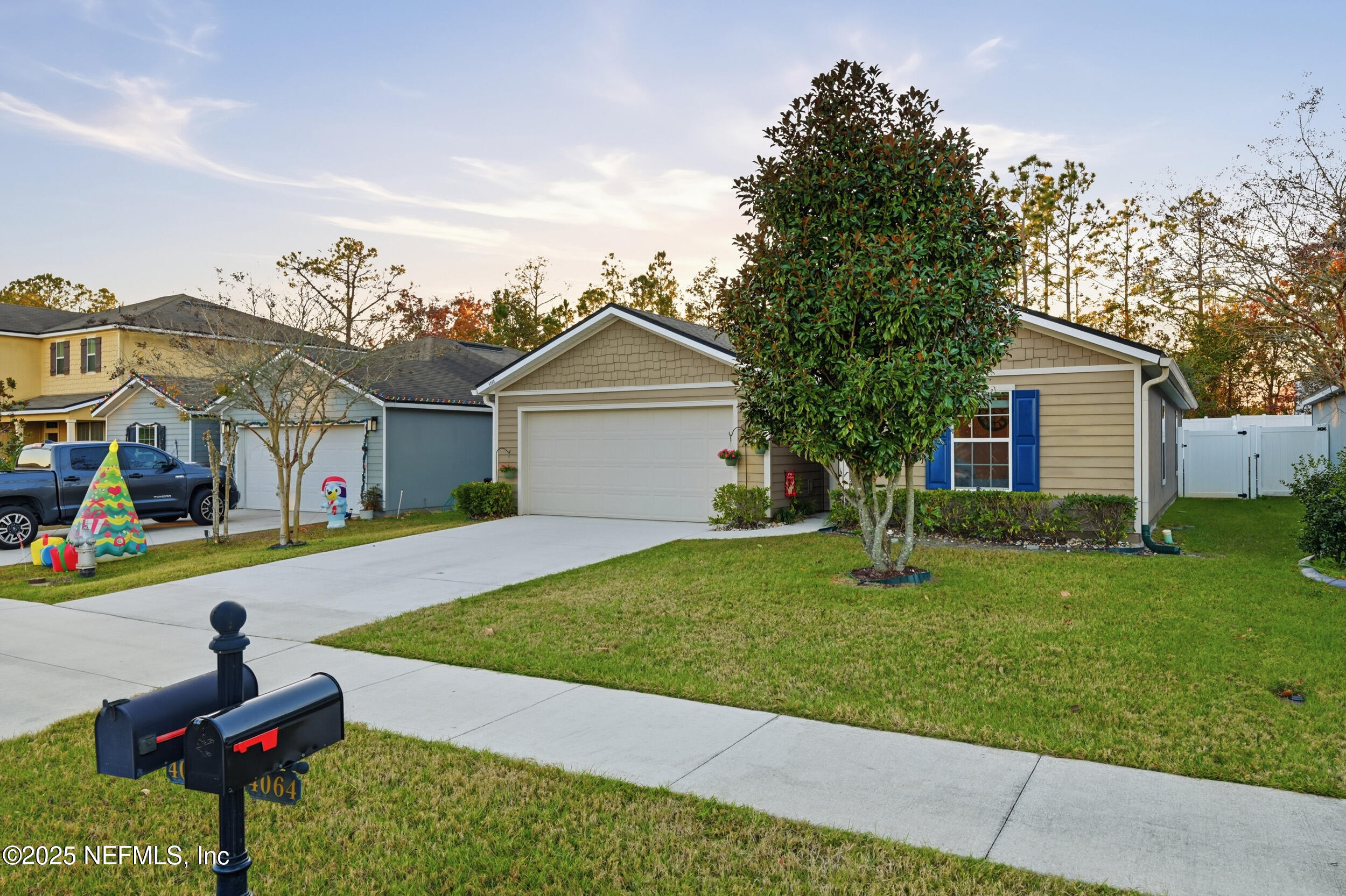 4068 Great Falls Loop Middleburg, FL 32068 - Photo 3 of 36 a front view of house with yard and outdoor seating