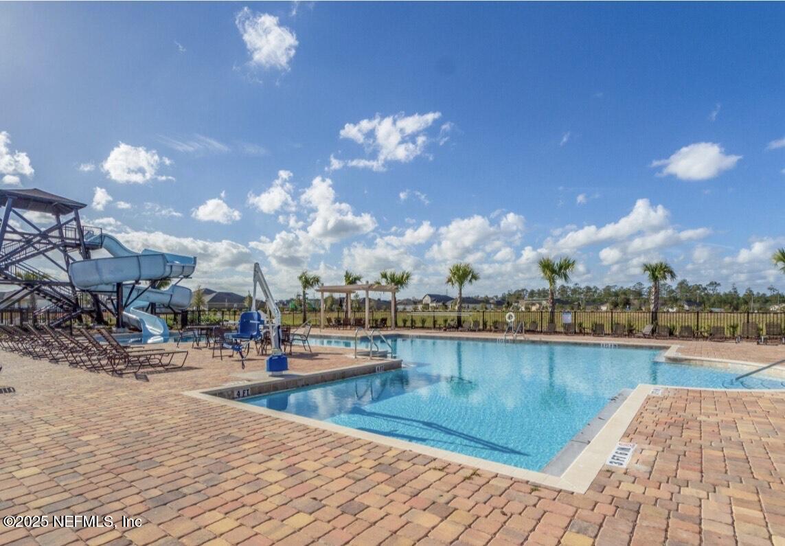 4068 Great Falls Loop Middleburg, FL 32068 - Photo 33 of 36 a view of a swimming pool and lounge chair